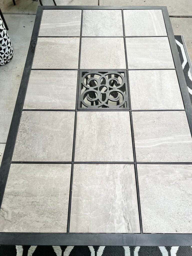 A straight on shot of the black and grey patio table before it's refresh.