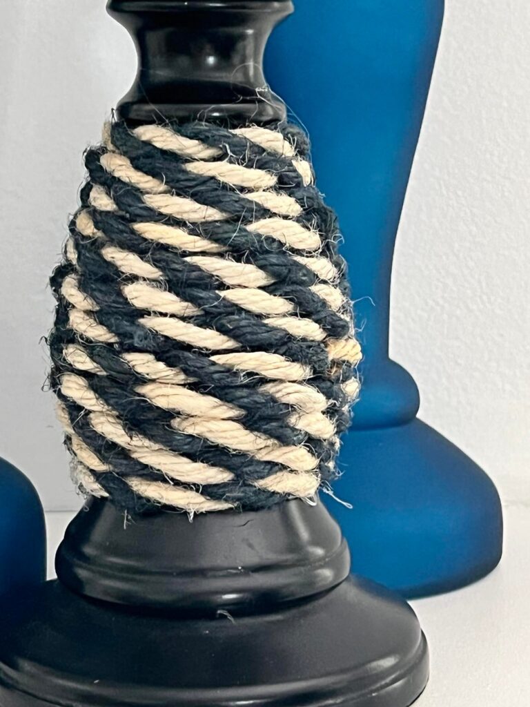 Striped jute rope glued to the black candlestick base.