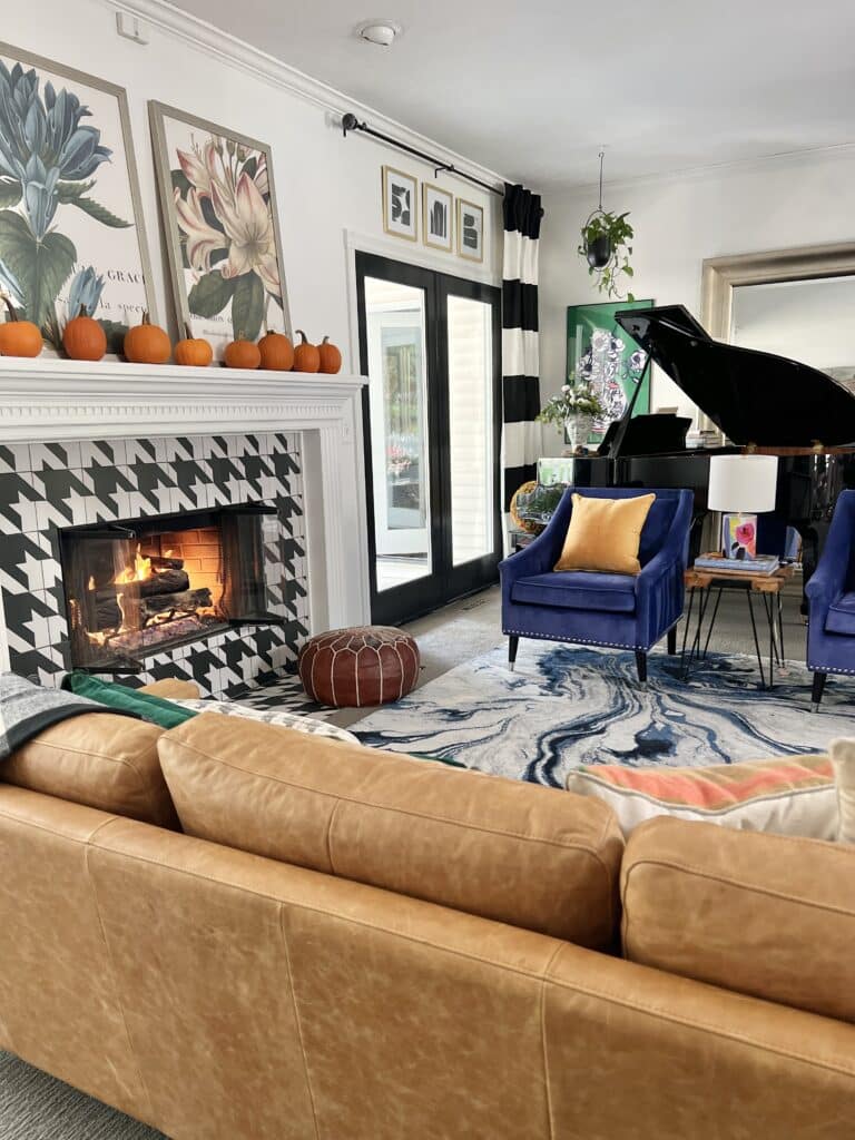 You can see the piano, sofa, cobalt blue chairs, fireplace with houndstooth tile and fireplace mantel with sugar pumpkins in this part of the Fall Living Room Tour.