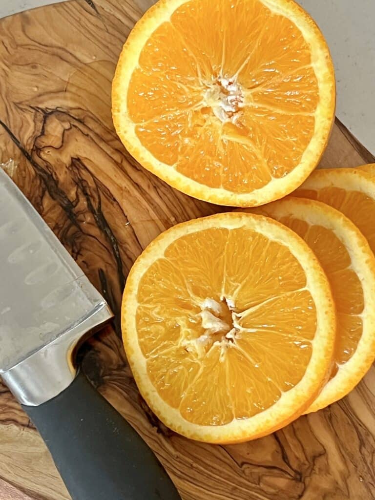 Orange slices on a cutting board.