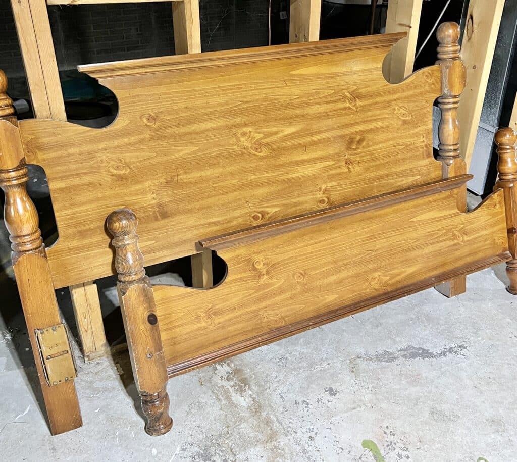 The "Before" photo of a brown wood headboard and footboard.