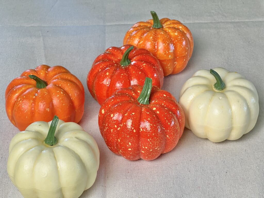 white and orange pumpkins to be used for the hanging pumpkin ball