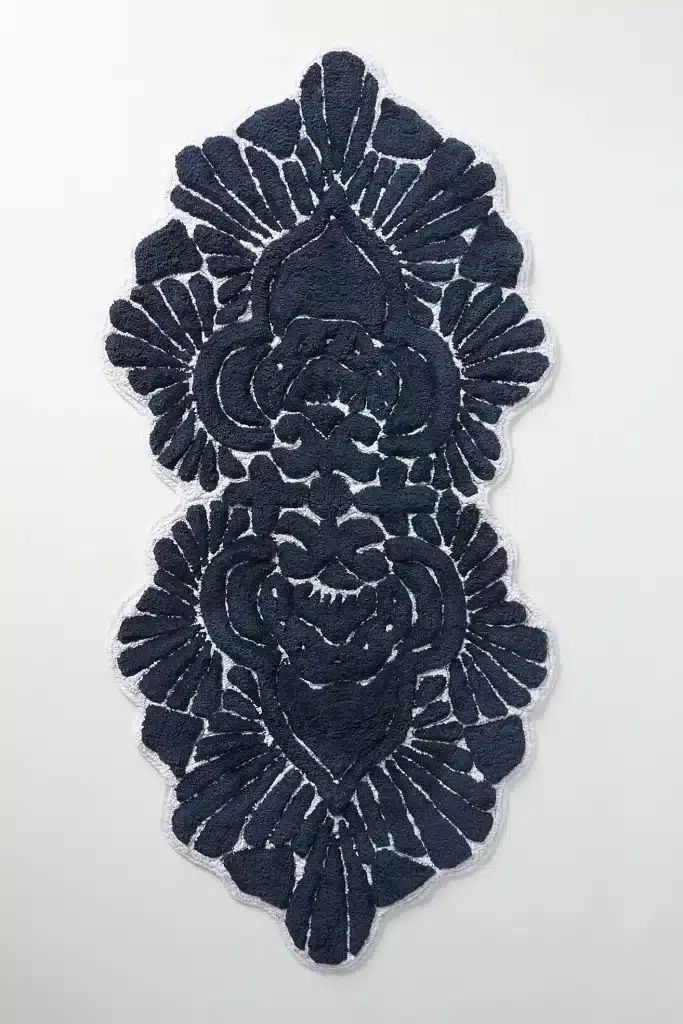 A navy blue bath mat available at Anthropologie.