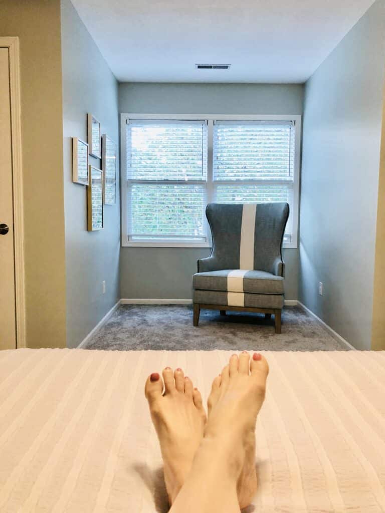 A "before" shot of the reading nook that sits opposite the bed. Ready to be turned into a special spot in this cozy guest bedroom.