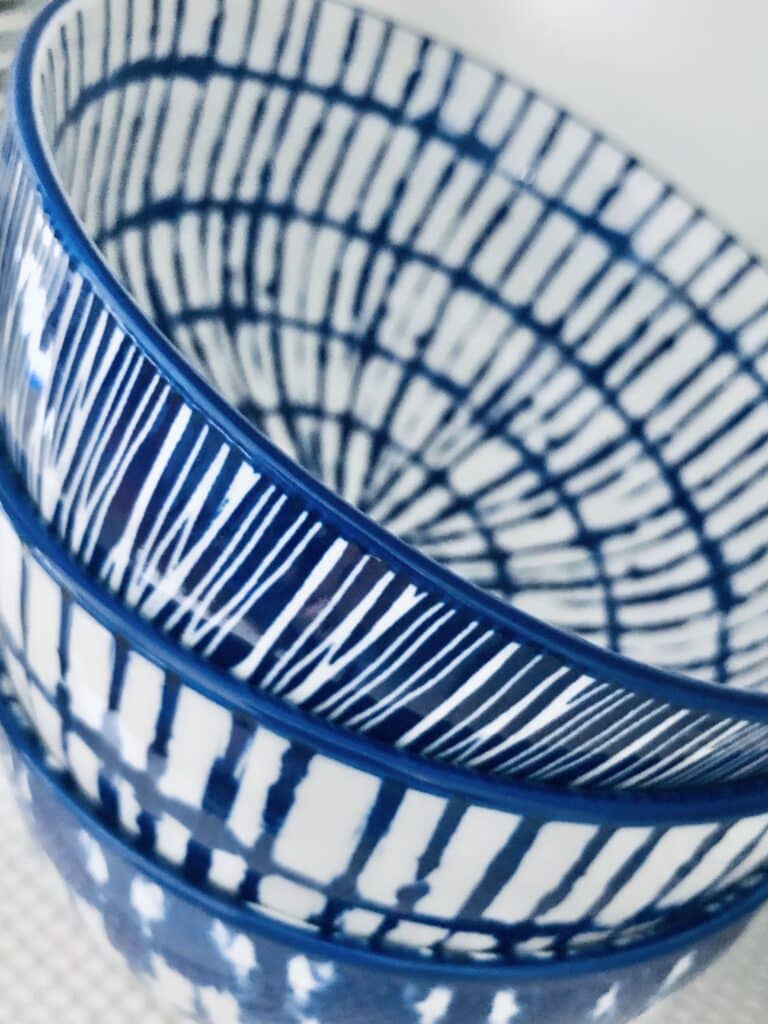 A stack of blue and white patterned bowls.