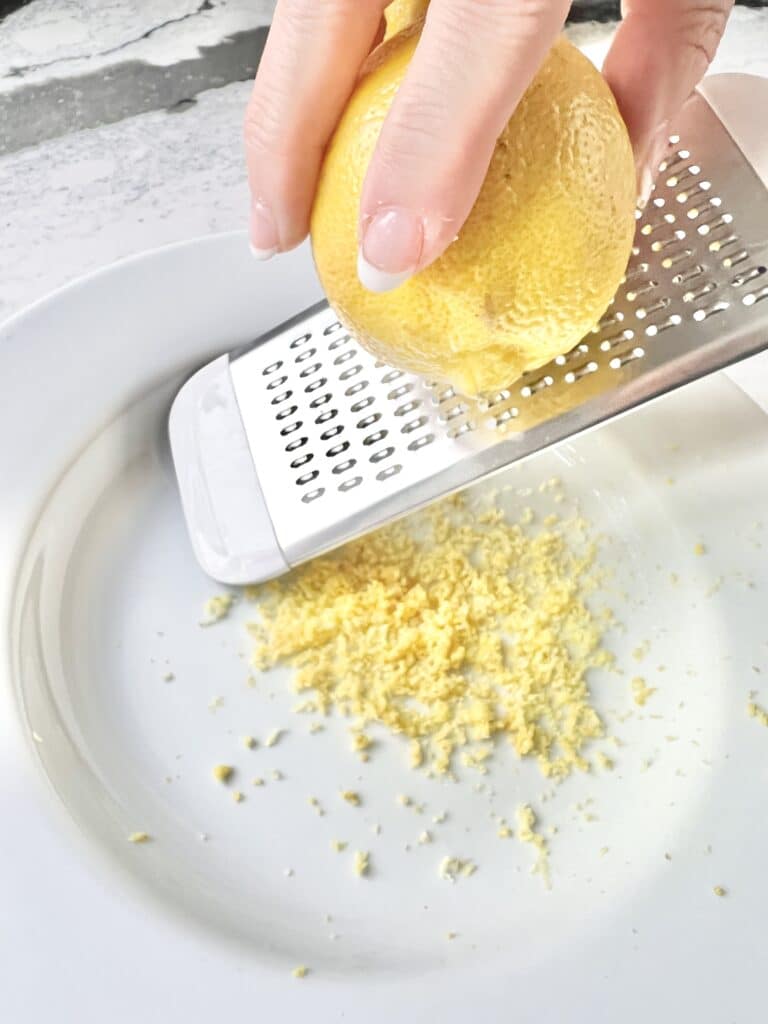 Zesting a lemon for a lemon curd recipe.