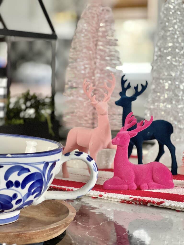 Multi-colored reindeer complete this Christmas centerpiece idea.