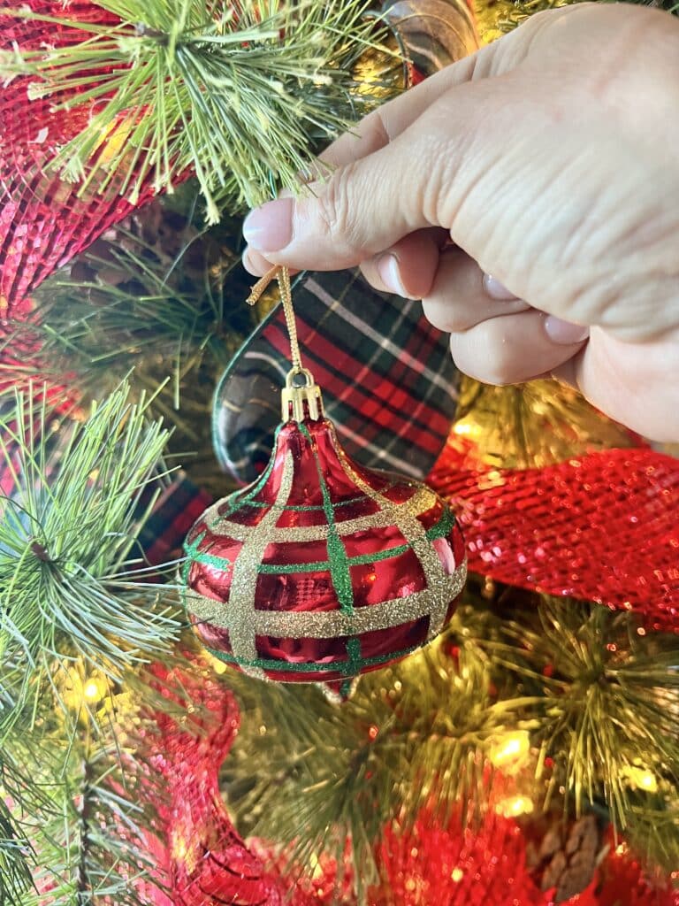 Hanging an ornament.