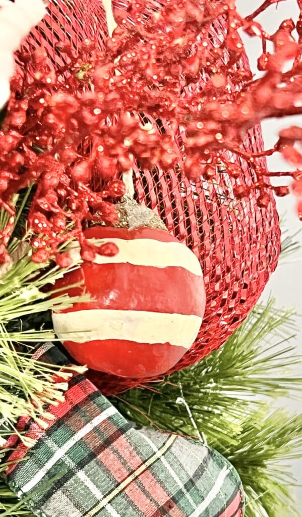 A red and white striped ornament.