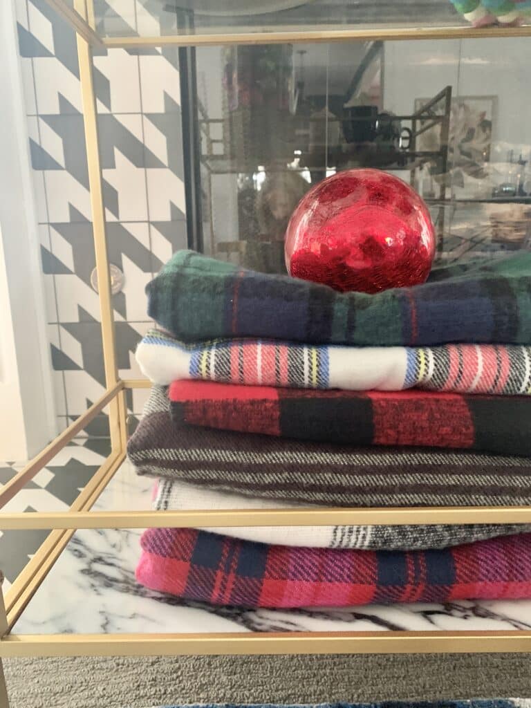A pile of plaid flannel blankets.