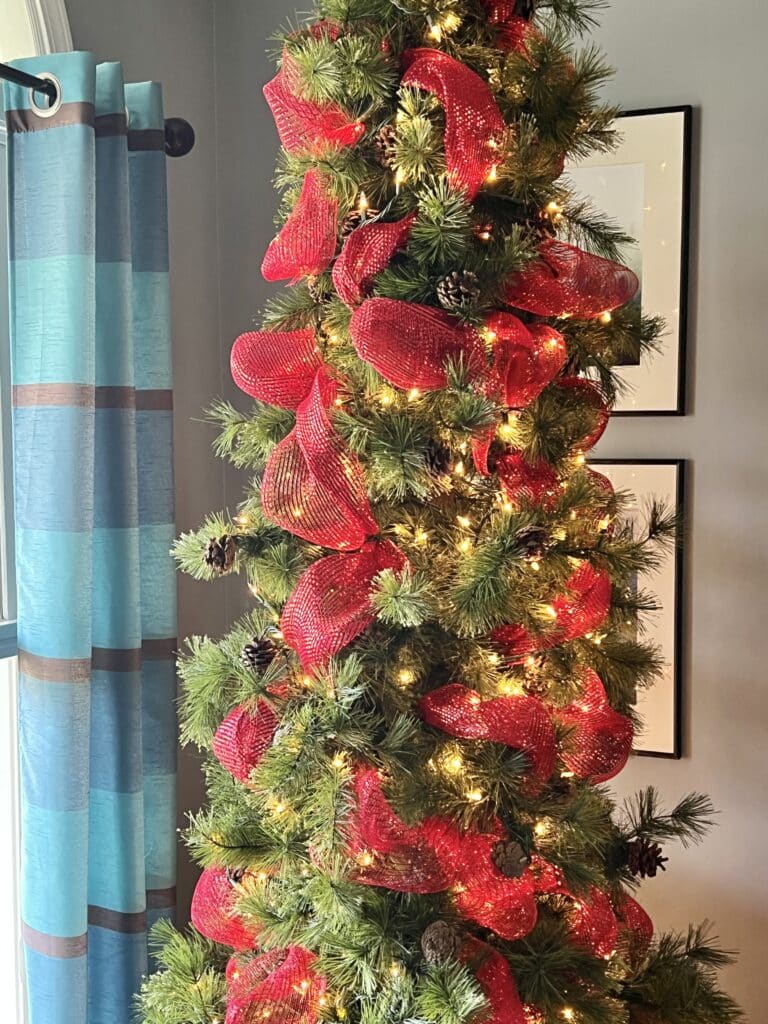 Red ribbon looped onto the tree.