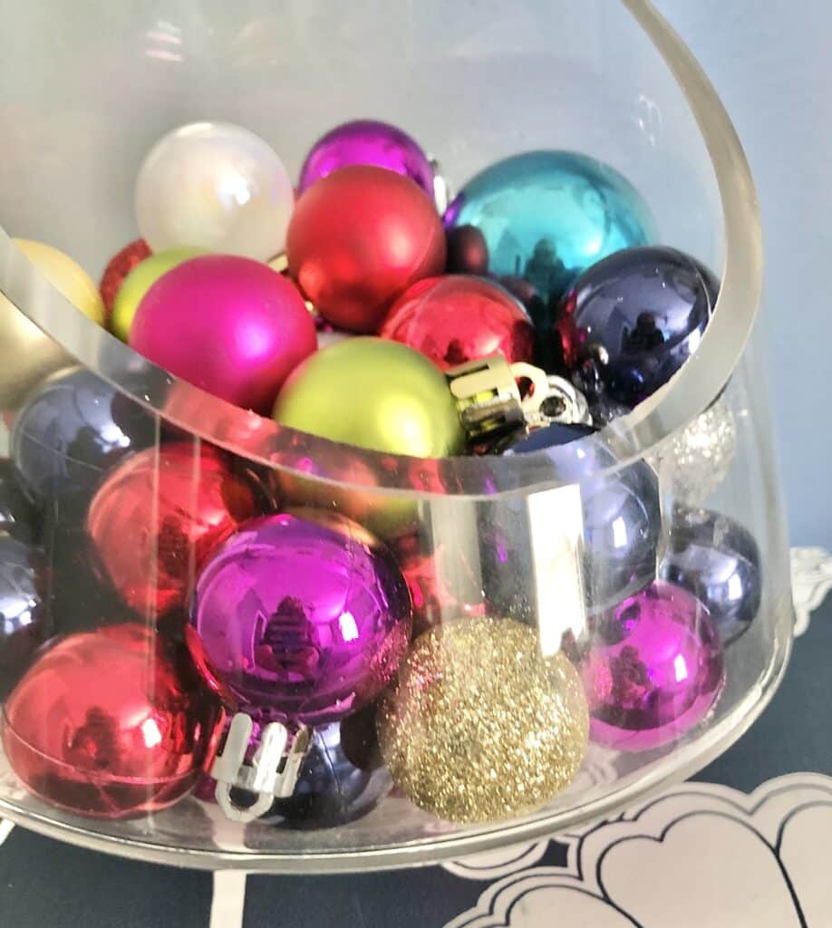 Christmas ornament wreath DIY: A glass jar full of Christmas ornaments.