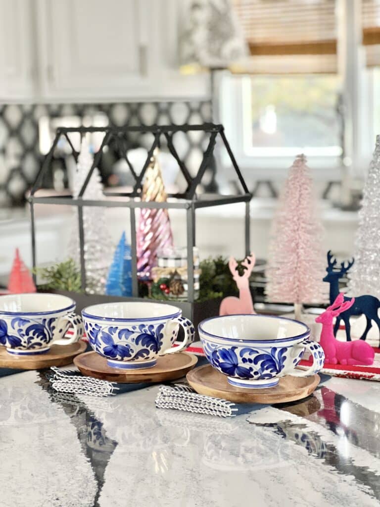 Blue and white soup bowls decorate a kitchen island for Christmas.