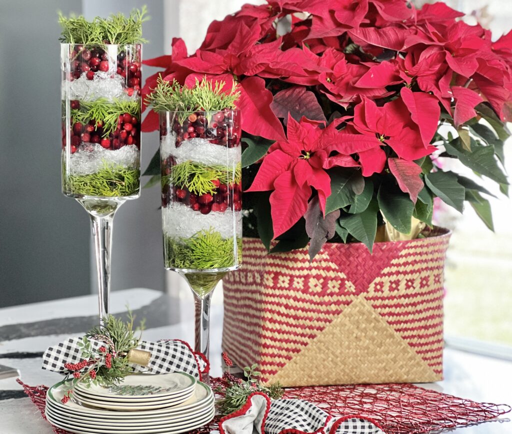 A Christmas centerpiece made from evergreens, cranberries, and plastic wrap.