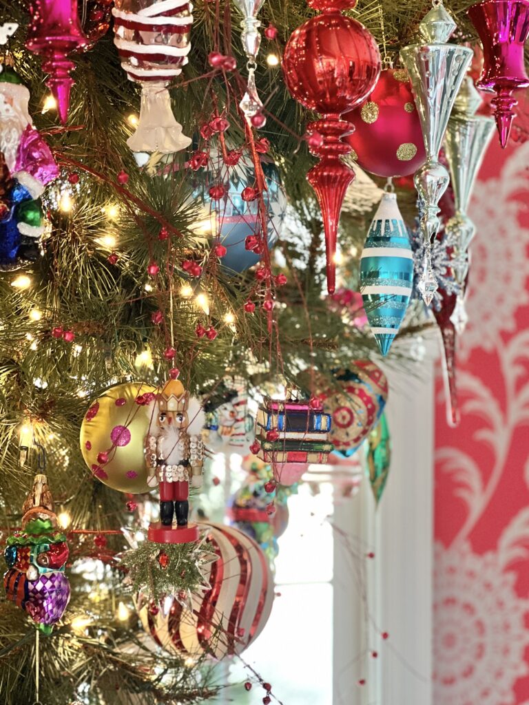 Finial glass ornaments hanging from the Christmas tree.