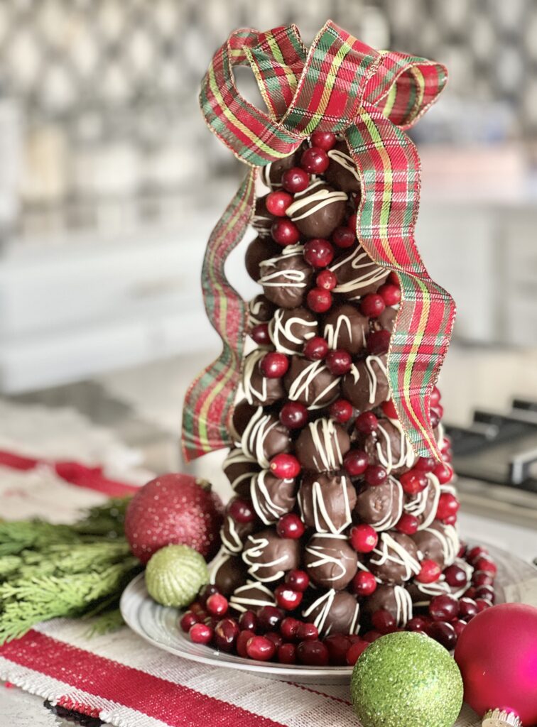 A decorated chocolate truffle Christmas tree.