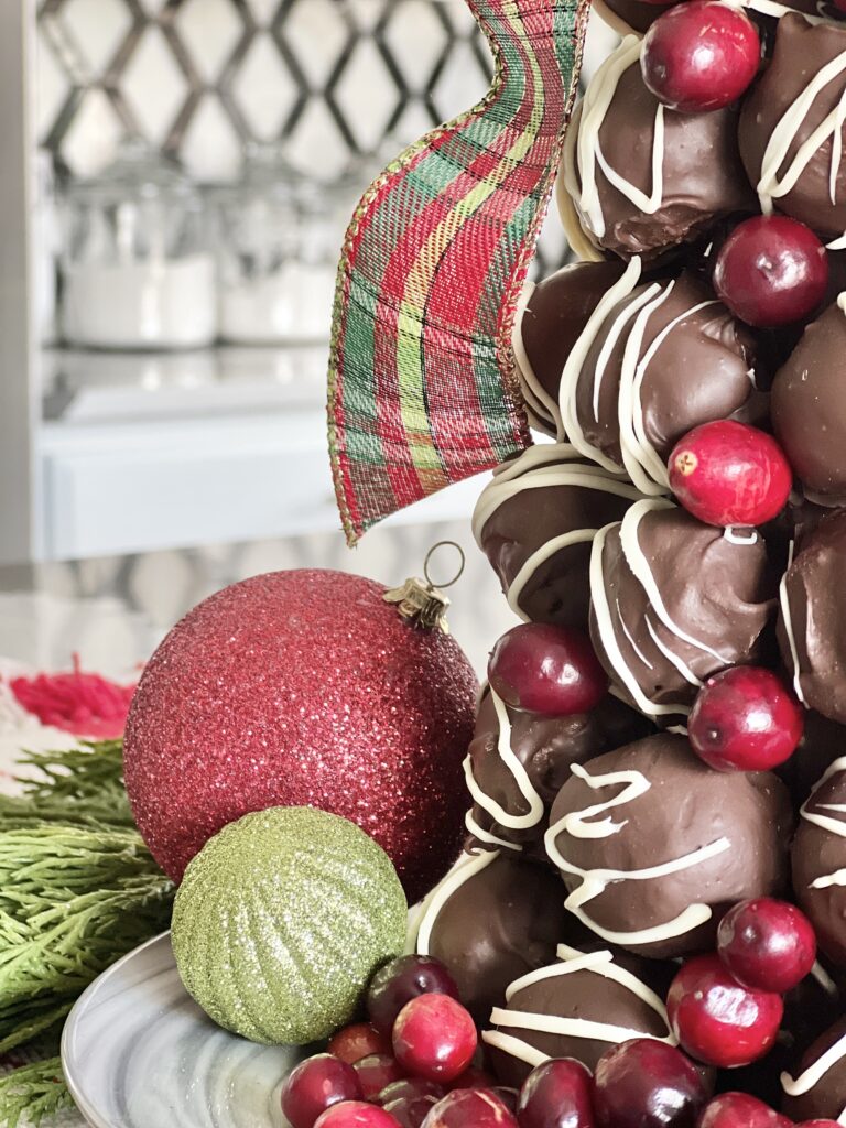 Inserted fresh cranberries in the gaps between the chocolate truffles.