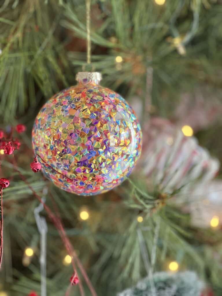 A sparkly round Christmas ornament.