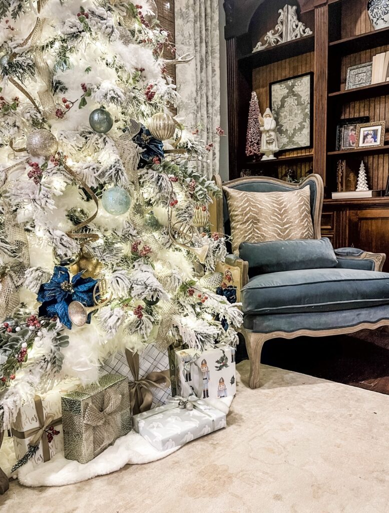 The blog At Home with Kristy features this white Christmas tree and French blue armchair in her Christmas home tour.