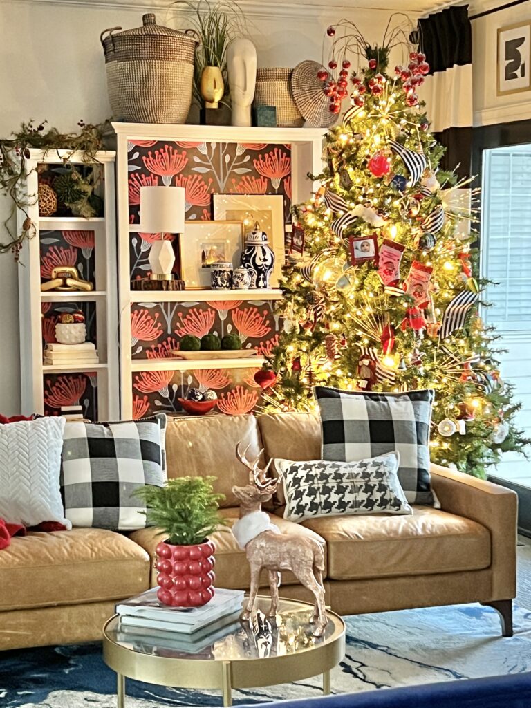 The family Christmas tree sits in a corner behind the sofa for this home tour.