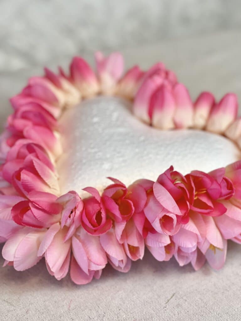 A second layer of tulips inserted into the foam heart.