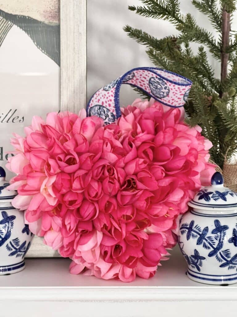 The tulip heart Valentine's Day decor nestled among blue and white porcelain jars.