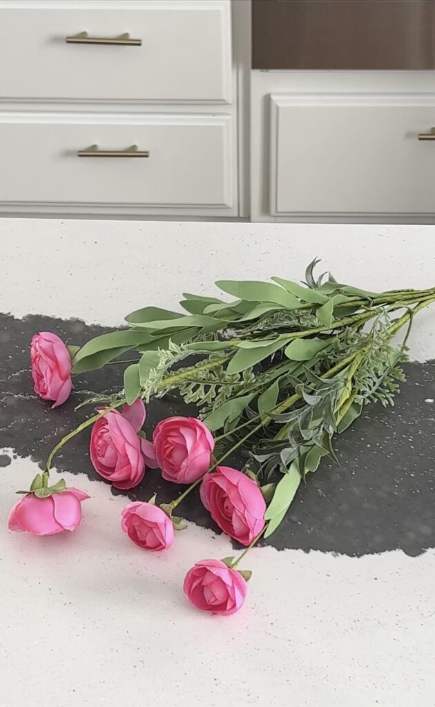 A single bunch of pink flowers that can be purchased at any craft store for a few dollars.