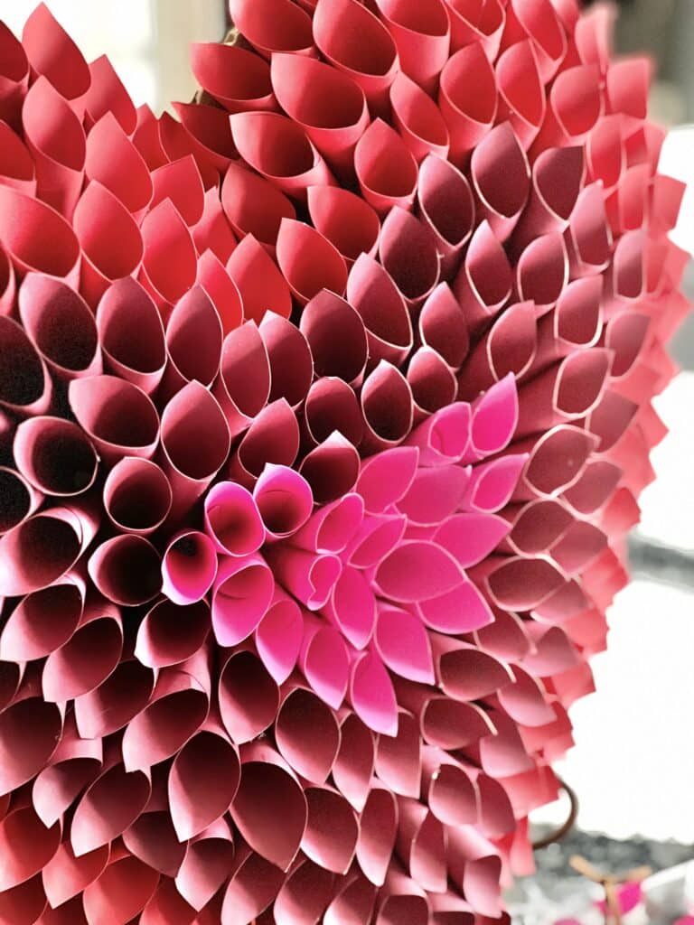 A third shade of pink added to the paper heart DIY Valentine's Day  heart.