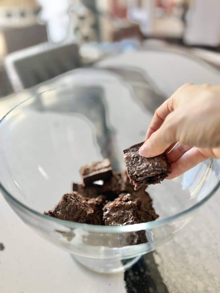 The first layer of brownies in the chocolate trifle dessert.