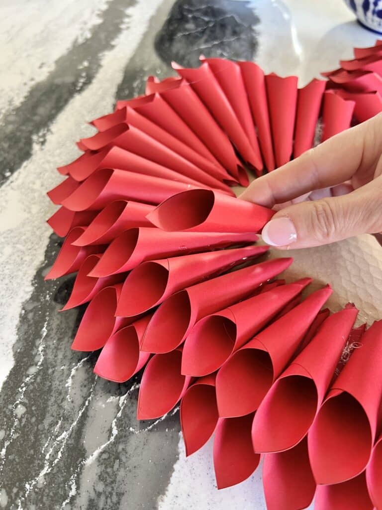 Adding layers of paper cones to the heart.