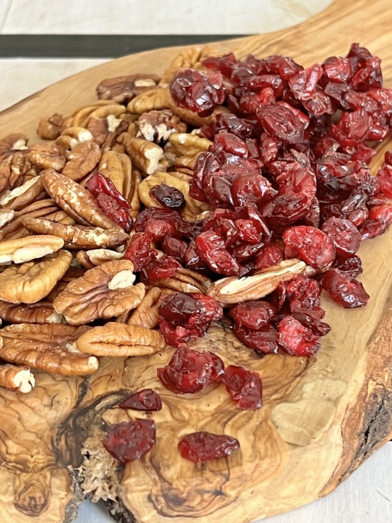 Pecans and dried cranberries for a Cranberry Pecan Bagel Spread.