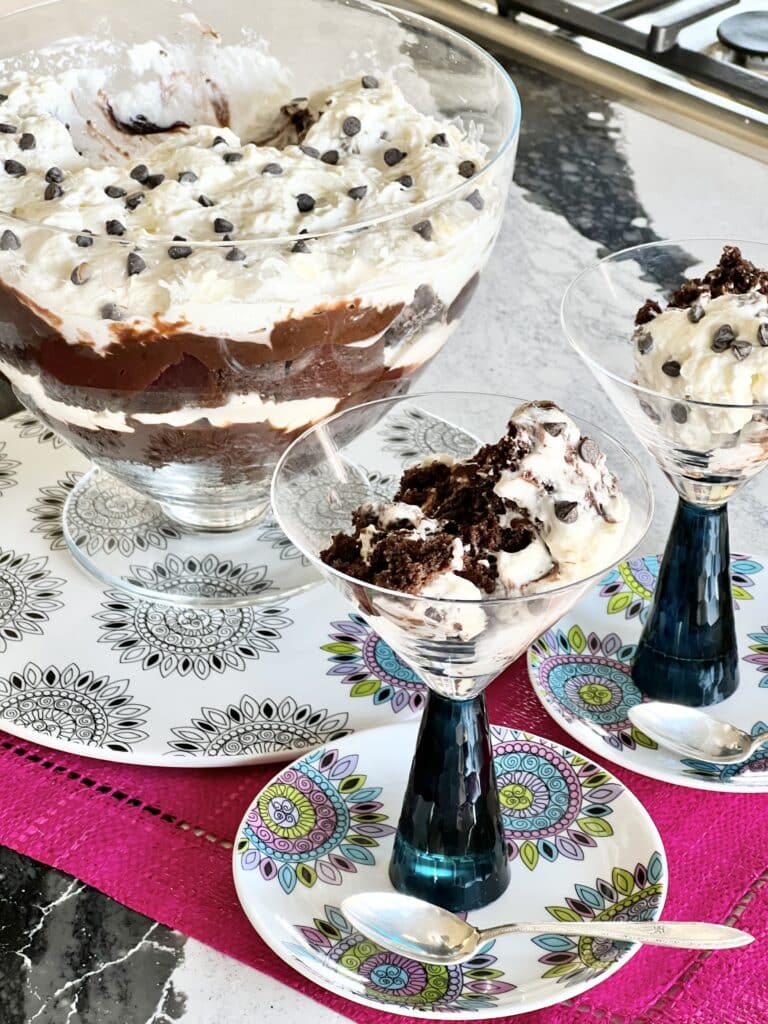 A chocolate trifle in a glass trifle bowl.
