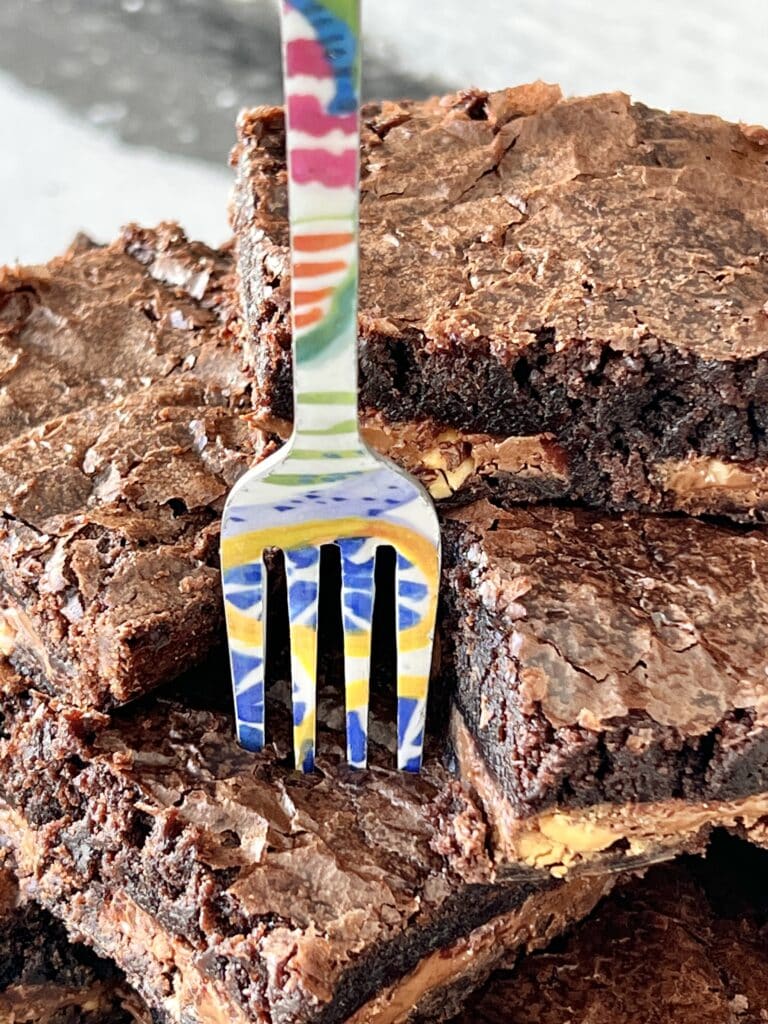 A colorful fork stuck in a Symphony brownie.