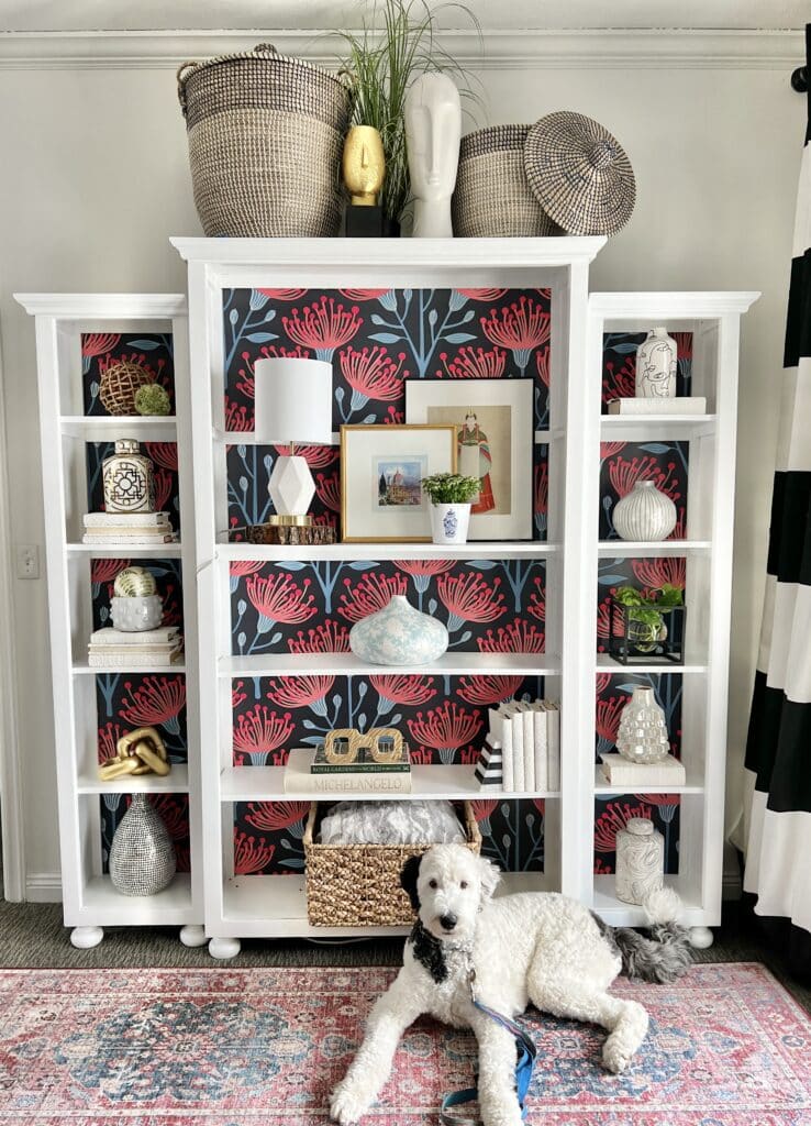 The completed painted and wallpapered bookcase looks amazing after its makeover. So much lighter and brighter than before.