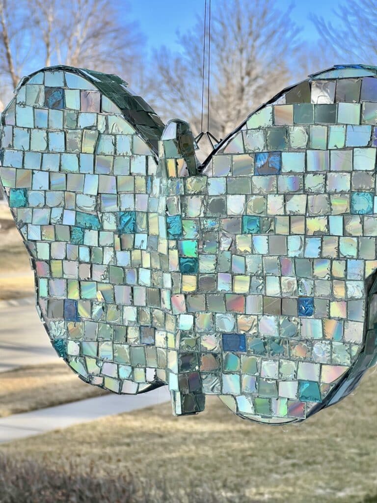 A hanging butterfly made from old CDs.