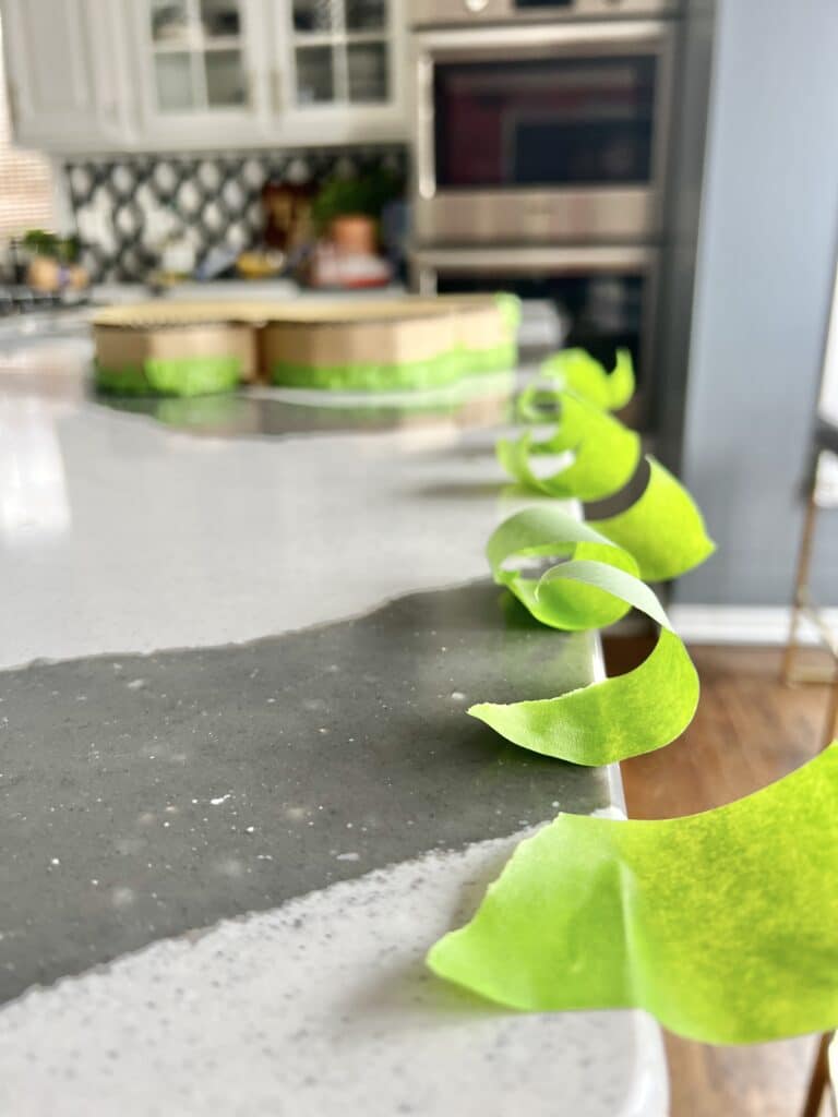 A row of green tape ready to be used in creating outdoor hanging decor.