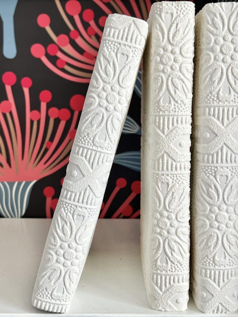 Books covered in wallpaper.