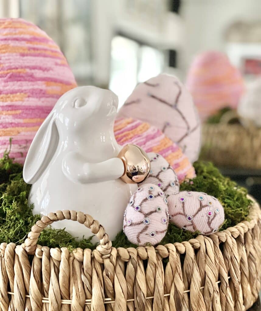 Decorative spring eggs displayed in a woven Easter basket.
