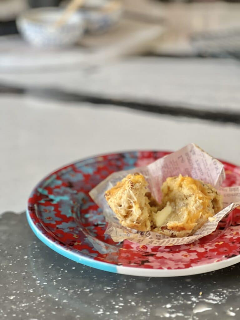 Butter melting on a plated muffin.