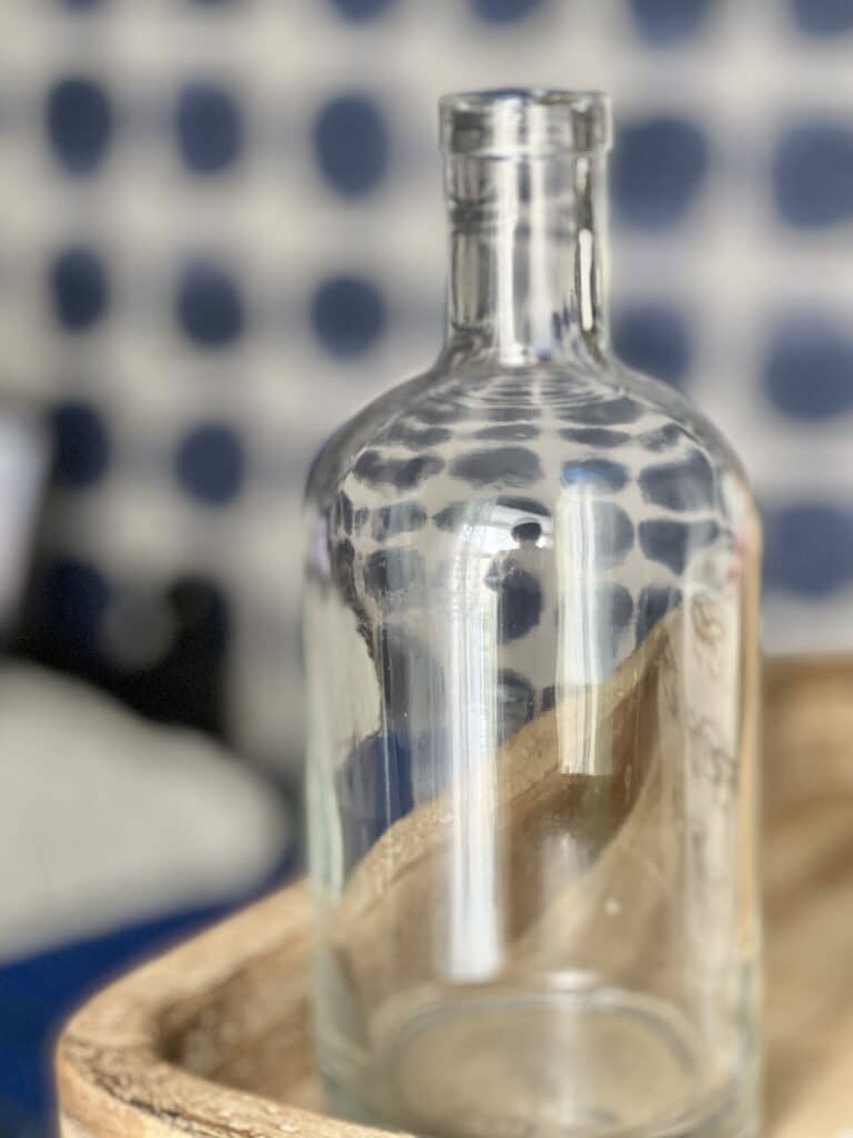 A single glass recycled bottle.