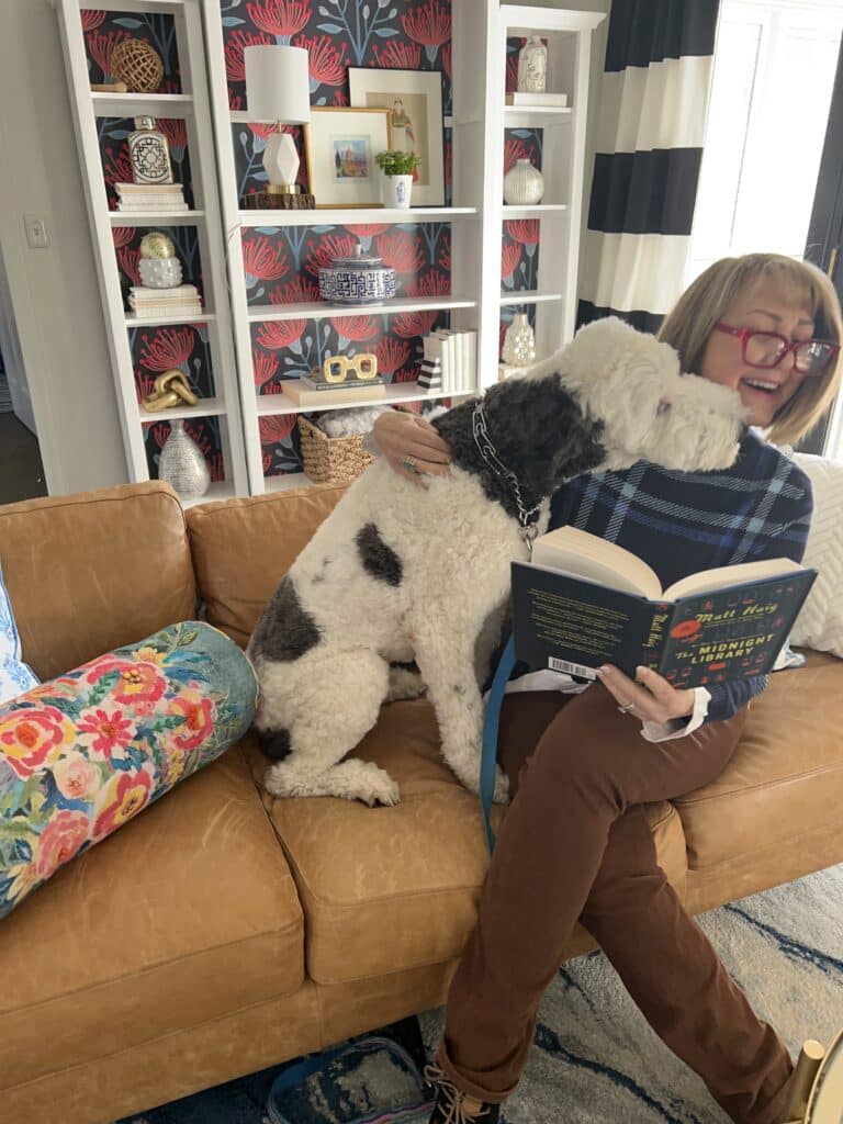 The dog lunging to lick Missy's face.