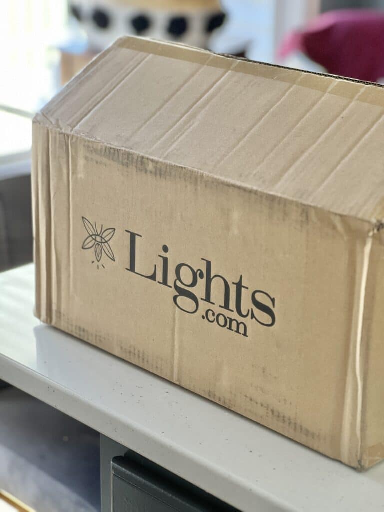 A box of wall sconces from lights.com.