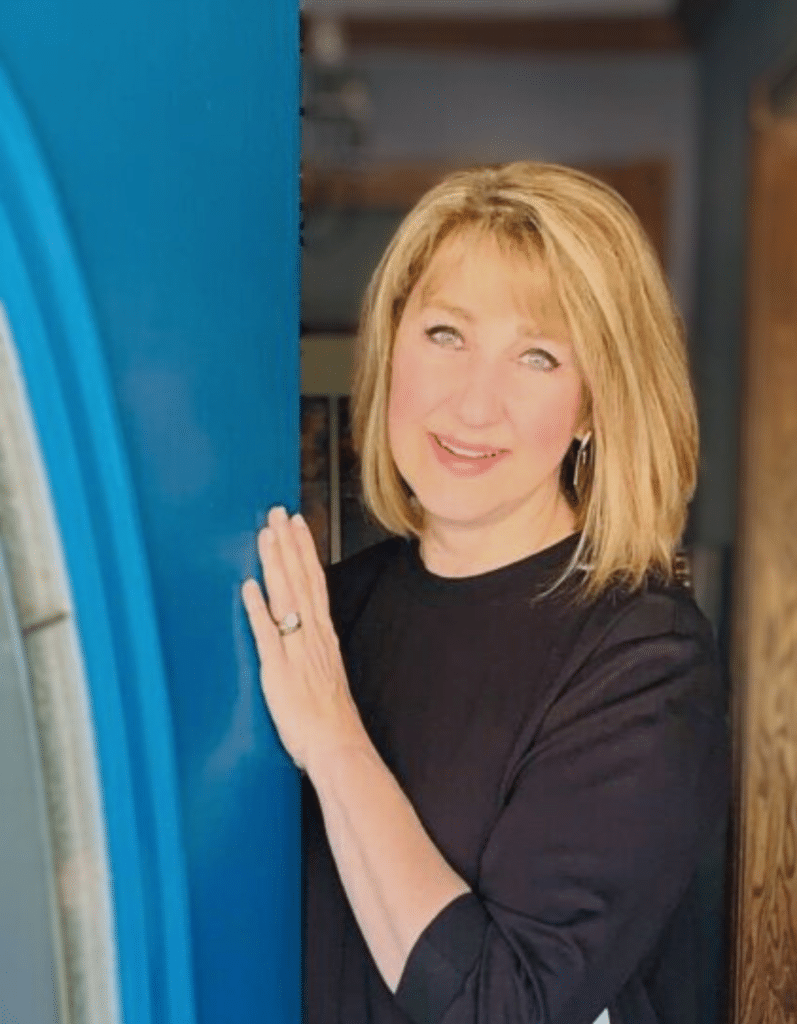 Missy opening the blue front door.