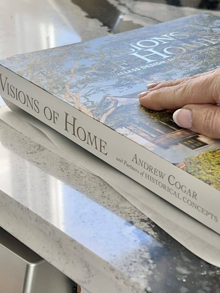 A thick book sitting on top of floral blooms.