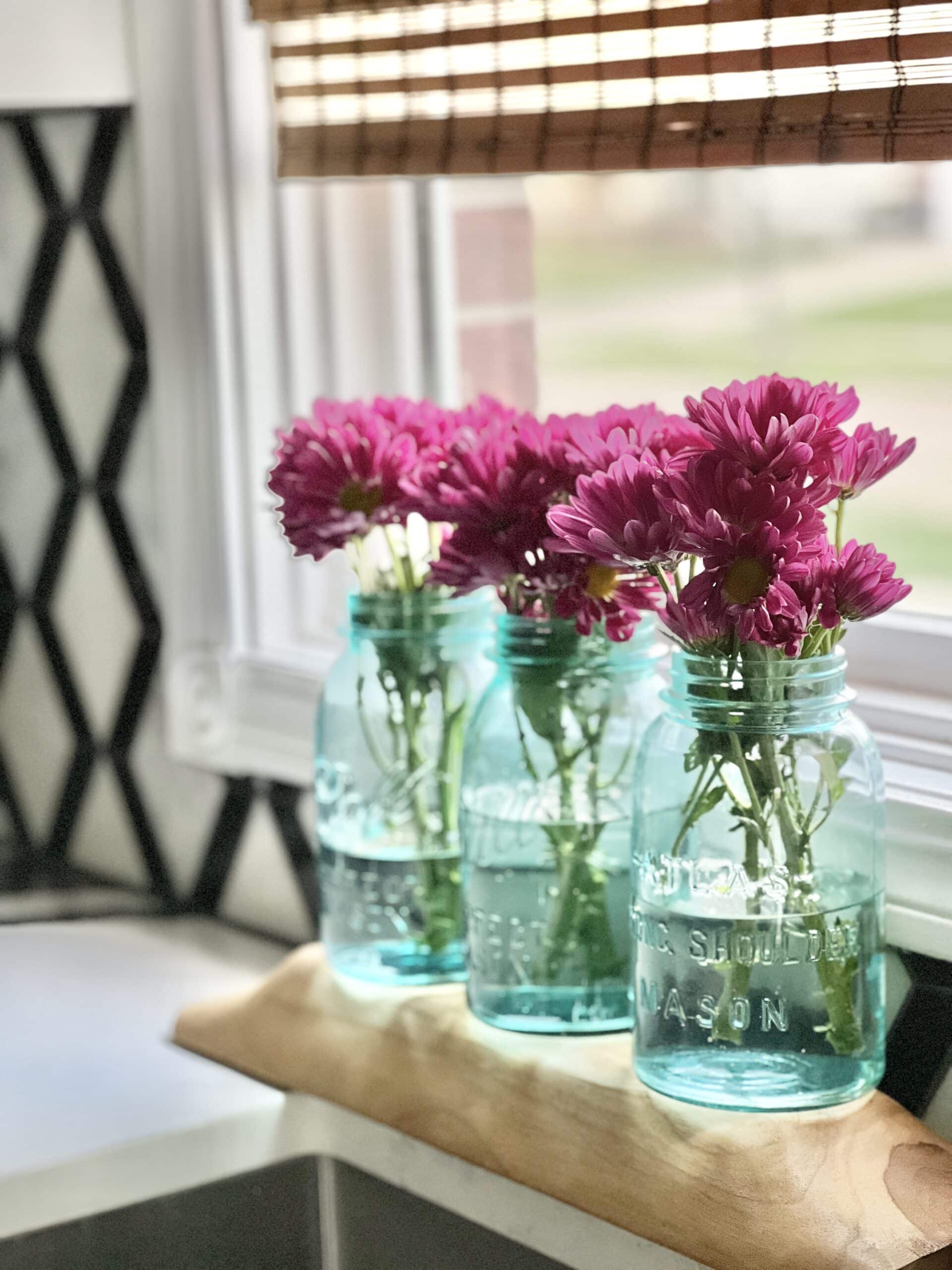 recycled food jars turned storage jars with glass knob tops