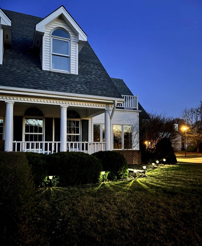 Refreshed solar pathway lights spaced evenly apart and lining the front house perimeter.