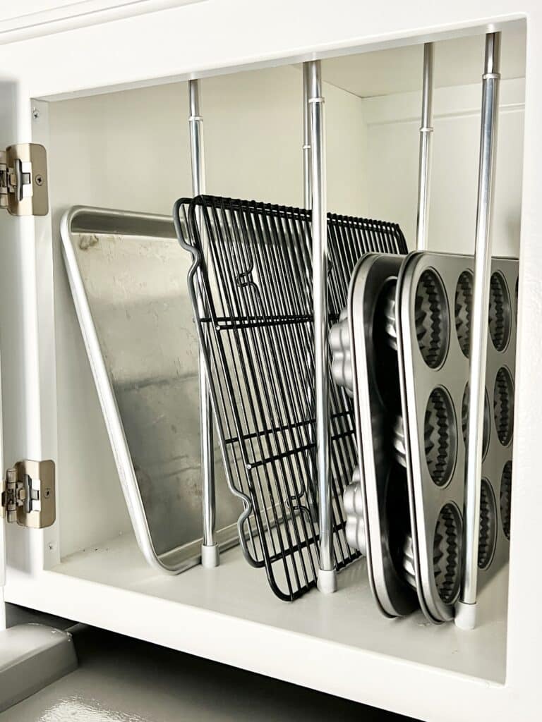 DIY tension rod shelving for baking sheets.