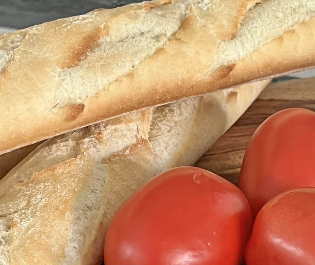A close up photo of two french baguettes.