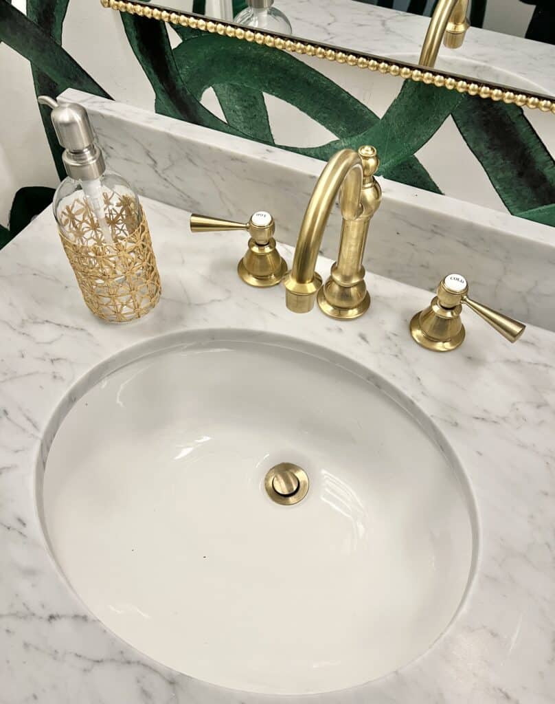 A vanity with lots of surface area is one of the good half bath makeover ideas.