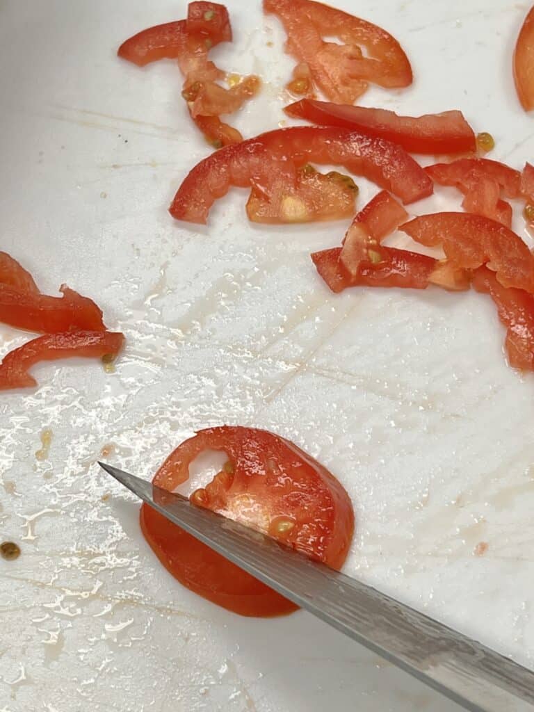 Slicing tomatoes.